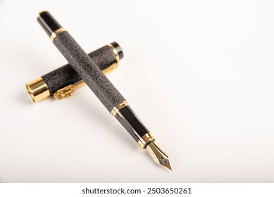 Fountain pen, beautiful fountain pen positioned on white background, selective focus.