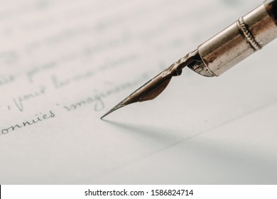 Fountain pen on an ancient handwritten letter. Old story. Retro style. - Shutterstock ID 1586824714