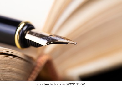 fountain pen on old open book. - Powered by Shutterstock