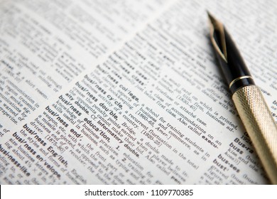 fountain pen and open dictionary - Shutterstock ID 1109770385