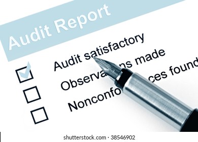 Fountain Pen Over Audit Report, With Check Mark Against 