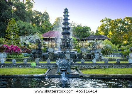 Fountain with pig statue in Tirtagangga Water Palace, Karangasem, Bali surrounded with beautiful green park