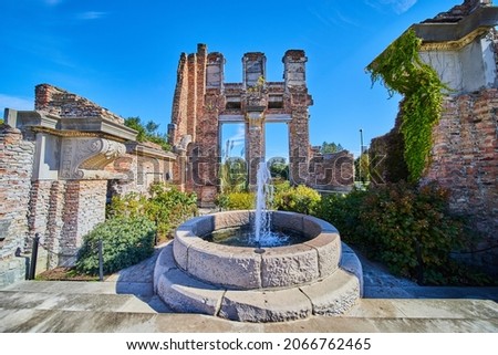 Fountain set in old ruins of brick and stone
