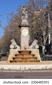 Fountain With Stone Plinth And Sculpture On Barcelona Traffic Island