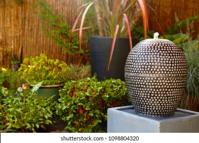 Fountain Water Feature In A Garden Yard With Running Water