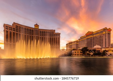 Fountains of Bellagio hotel with bright lights of hotels on Las Vegas Strip in Paradise, Nevada. Las Vegas, USA - September 28, 2018.