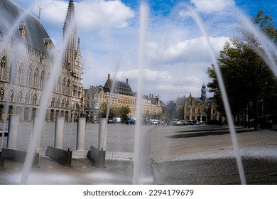 
Fountains in the market square of Ypres on a beautiful sunny day. Tourist image for promotion of Ypres Belgium or Ieper België.  Capital of the westhoek belgium.  Lakenhalle, Belfort, Niewerck.