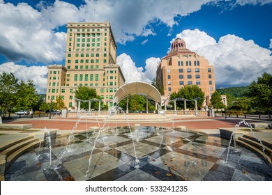 Fountains at Park Square Park and buildings in downtown Asheville, North Carolina.