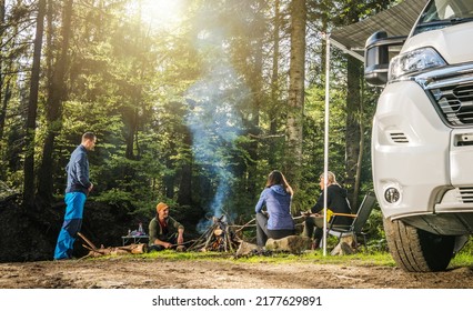 Four Adult Caucasian Friends in Their 40s Hanging Out Next to Campfire During Wilderness Boondocking Camper Camping - Shutterstock ID 2177629891