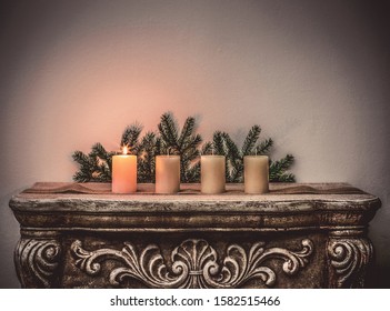 Four Advent candles on fireplace, first Advent