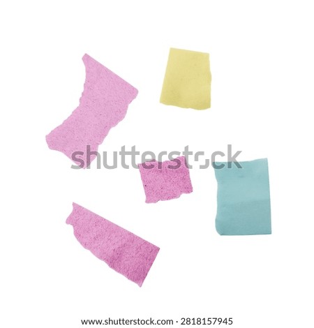 Four assorted colored cleaning sponges on a plain background