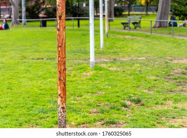 Four Australian Football Goal Posts, One That Is Very Rusted, At A Suburban Football Oval In Brunswick East ,Melbourne, Australia