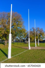 Four Australian Football Goal Posts In A Suburban Park In Melbourne, Australia.