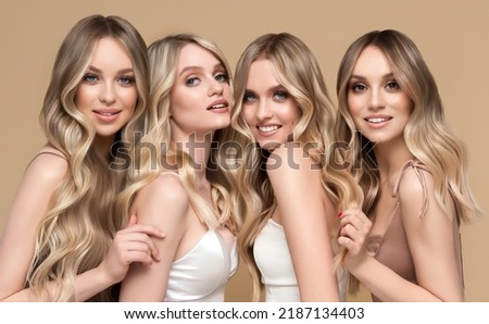 Four beautiful women    with hair coloring in ultra blond. Stylish hairstyle curls done in a beauty salon. Fashion girls , cosmetics and makeup.
