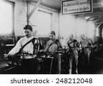 Four Belgian WW1 veterans with a prosthetic arms working in a machine shop in 1917. The occupational therapy took place at the Institute de Port Villez, Belgium.