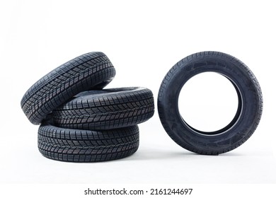 four black tires isolated on white background - Shutterstock ID 2161244697