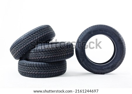 four black tires isolated on white background