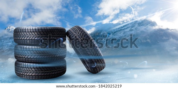 four black tires\
Winter tire in snowfall