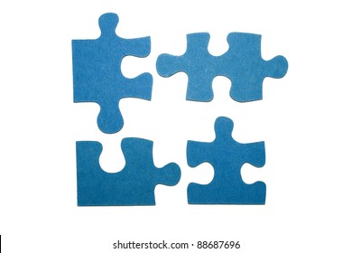 Four Blue Pieces Of A Puzzle With A White Background