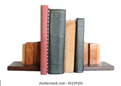 Four Books Standing Up With Book Ends Isolated On White Background.