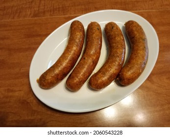 Four Boudin Links Stuffed With Ground Pork, Rice, Onions, and Seasoning in Natural Pork Casing. Louisiana Cajun Cuisine 