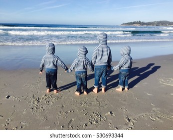 Four Boys Taking In The Waves