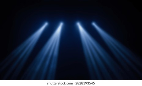 Four bright blue spotlights create visible beams of light against a dark background, suggesting a stage or performance setting.