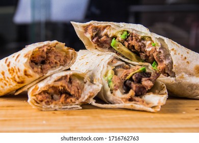 Four Burritos In Wood Base