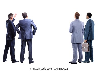 Four Business Mans From The Back - Looking At Something Over A White Background