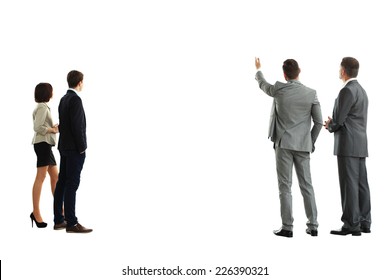 four business mans from the back - looking at something over a white background 