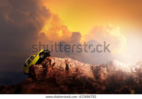 Four by four off road car crossing through the country\
road. Travel and racing concept for four wheel drive off road\
vehicle .