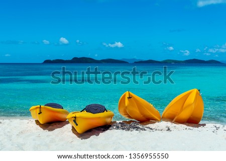 Four Canoes on a beautiful beach in the Caribbean. St. Thomas
