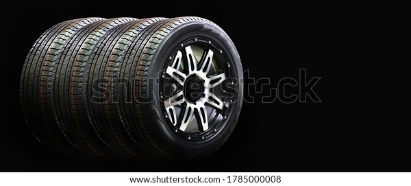 Four car wheel Rubber with Alloy Rim Isolated on\
Black Background,copy\
space
