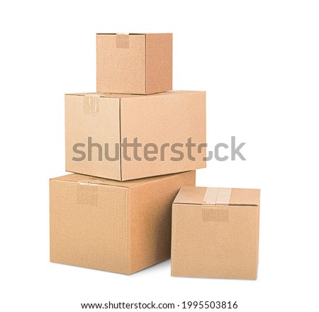 four cardboard boxes stacked in a pile on white isolated background