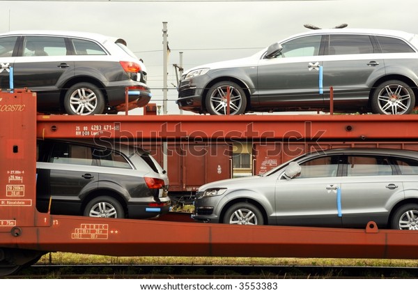 Four cars on rail\
platform