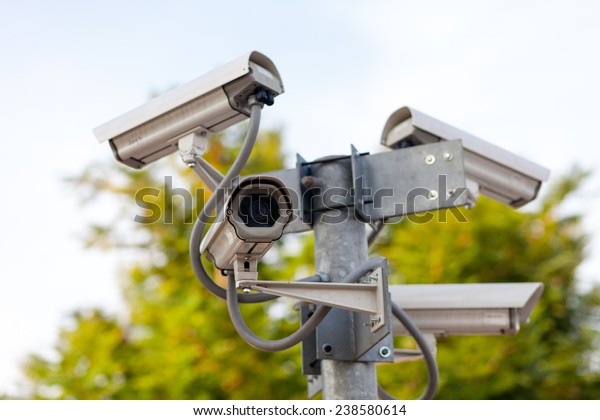 Four CCTV cameras on the\
junction