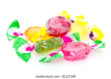 Four Cellophane-wrapped Pieces Of Colorful Hard Candy