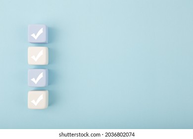 Four checkmarks against bright pastel blue background with copy space. Concept of questionary, checklist, to do list, planning, business or verification. Creative minimal composition  - Shutterstock ID 2036802074
