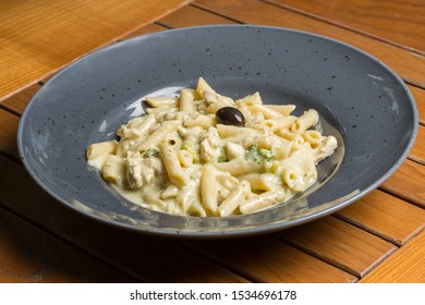 Four Cheese Pasta Served On A Restaurant Table