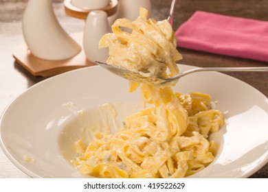 Four Cheese Pasta In A White Plate