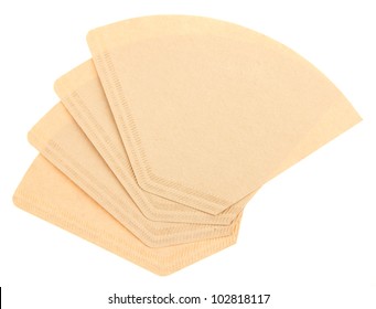 Four coffee filters isolated on a white background