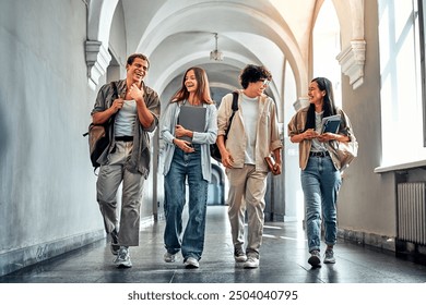 Four college student friends go to class talking and smiling. Smile, happy people and bonding education friends in global scholarship opportunity or open day.    