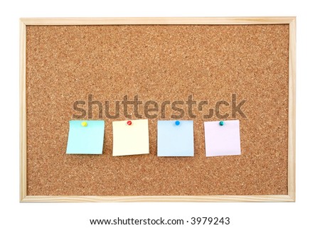 Four colorful blank post-it notes affixed to the corkboard - isolated on white