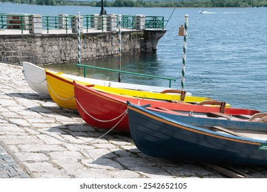 four colorful boats moored on the lakefront - Powered by Shutterstock