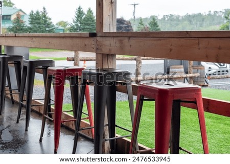 Similar – Image, Stock Photo Red tables, red stools, on them colorful plastic bowls, form a group of round shapes