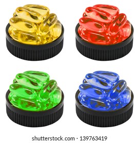 Four Colors Of Liquid Soft Gels In The Black Container. It Can Be Referred To Drug, Cure, Vitamin Or Poison.