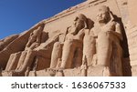 Four colossal statues of Ramesses II guard the entrance to his famous rock-cut temple at Abu Simbel, to honor himself as pharaoh.