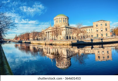 Four courts building in Dublin, Ireland with river Liffey