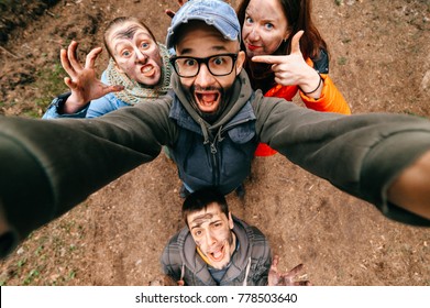 Four Crazy Funny People Selfie. Bizarre Scary Company Mess Outdoor. Disgusting Creepy Fellows Fooling Around. Unusual Dirty Face Emotions. Wide Angle Distortions. Evil Family. Expressive Men, Women