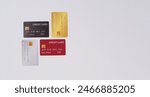 Four credit cards on white background.	

